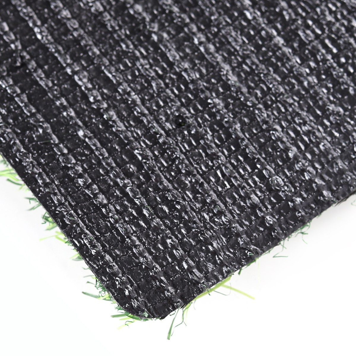 Backing with Drainage Holes - 25mm Artificial Turf - LFL Grass | Artificial Grass Manufacturer & Supplier Backing with drainage holes on 25mm artificial turf, durable backing